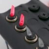 12V Switch Panel with Glow RED Toggles, 4 Gang + 2 Power Sockets, IP65 Rated – BlueFusion